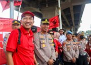 Polisi Amankan Jalur Lari Marathon Api Mrapen DPP PDIP Di Wilayah Jakarta Timur