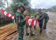 WARGA MUMUGU ANTUSIAS PASANG BENDERA MERAH PUTIH BERSAMA HABEMA
