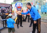 Polres Metro Bekasi Kota Gelar Pelayanan Publik Dalam Rangka HUT Bhayangkara Ke.79 Saat Car Free Day disambut Antusias Warga